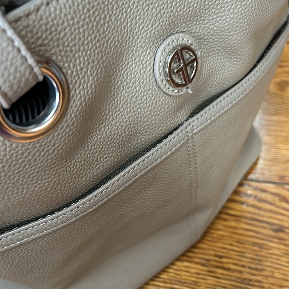 Taupe color leather tote.  Lots of pockets inside and out. - Picture 3 of 12